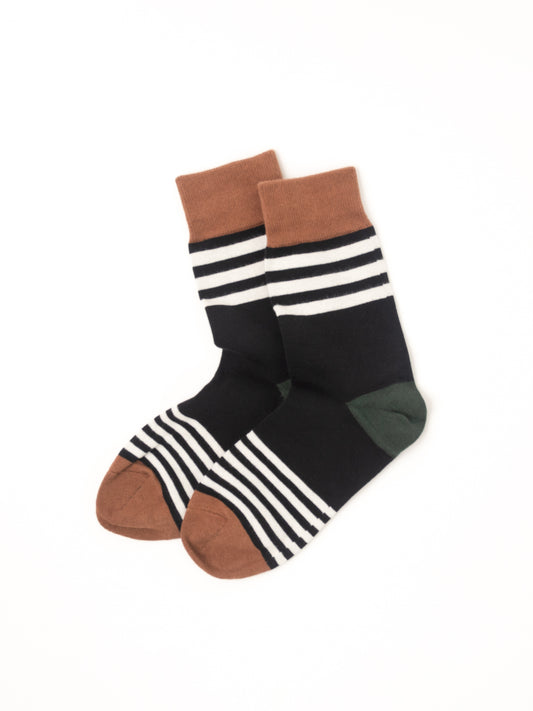 A pair of crew socks with a black body, white horizontal stripes on the upper leg and around the toe, brown heels and toes, and a dark green heel accent, displayed on a clean white background.