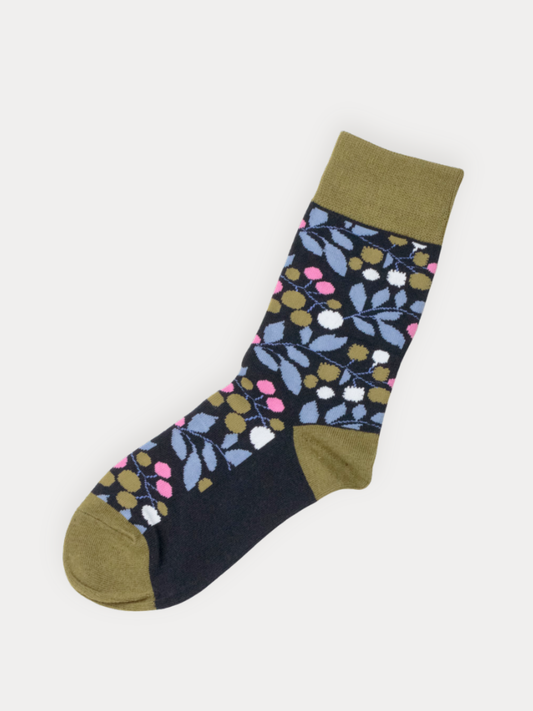 Floral patterned sock with green accents on a white background