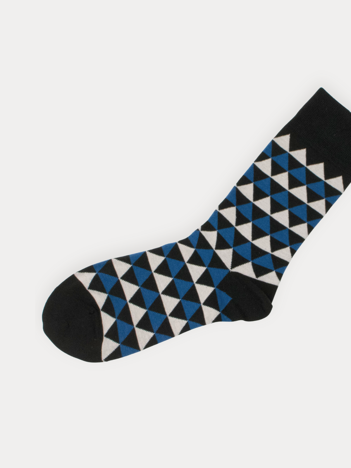 Black sock with blue and white geometric pattern on a white background