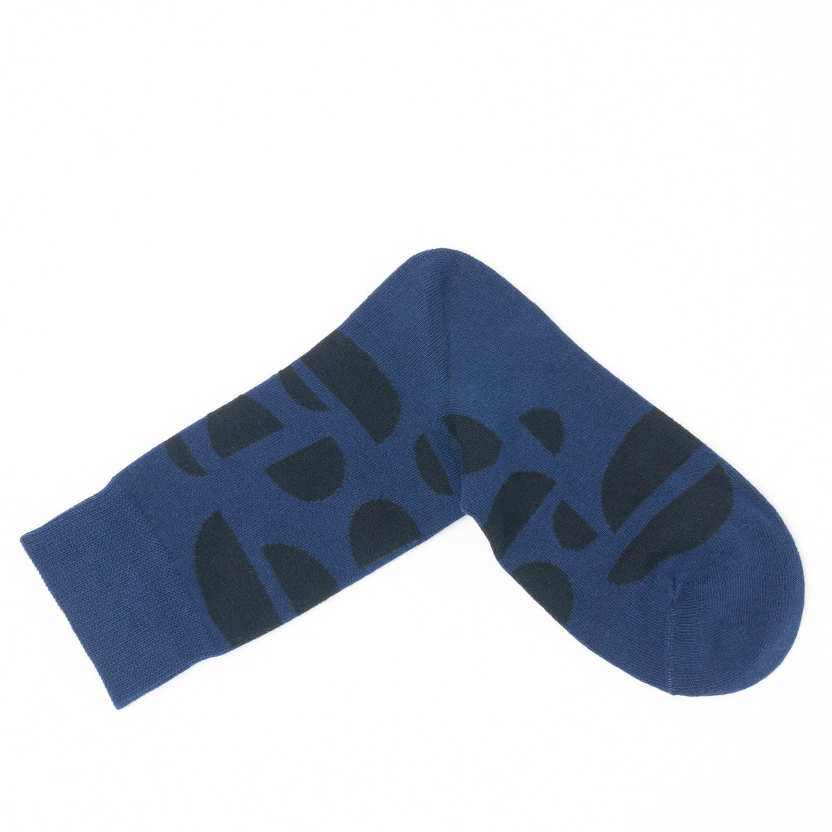 Single navy blue crew sock folded into a V shape, showing the dark abstract half-circle pattern.
