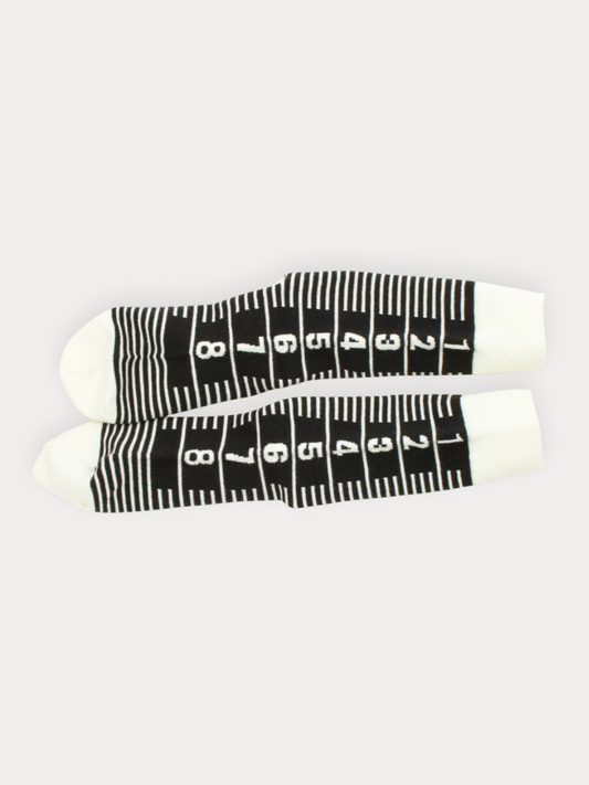 Soft white crew socks with a bold black barcode graphic.