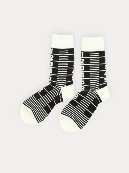 Soft white crew socks with a bold black barcode graphic.