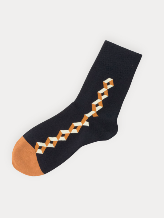 Black sock with geometric pattern and brown toe on a white background