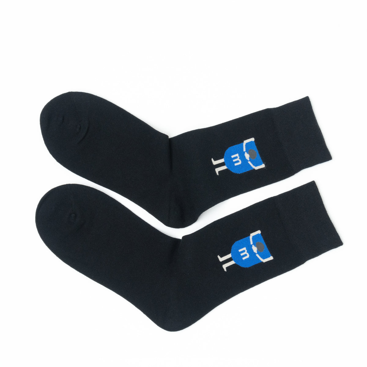 Pair of black crew socks folded together, showing the blue cartoon figure graphic near each cuff.