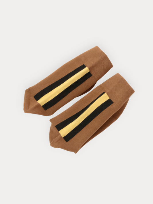 Pair of brown socks with black and gold stripes on a white background