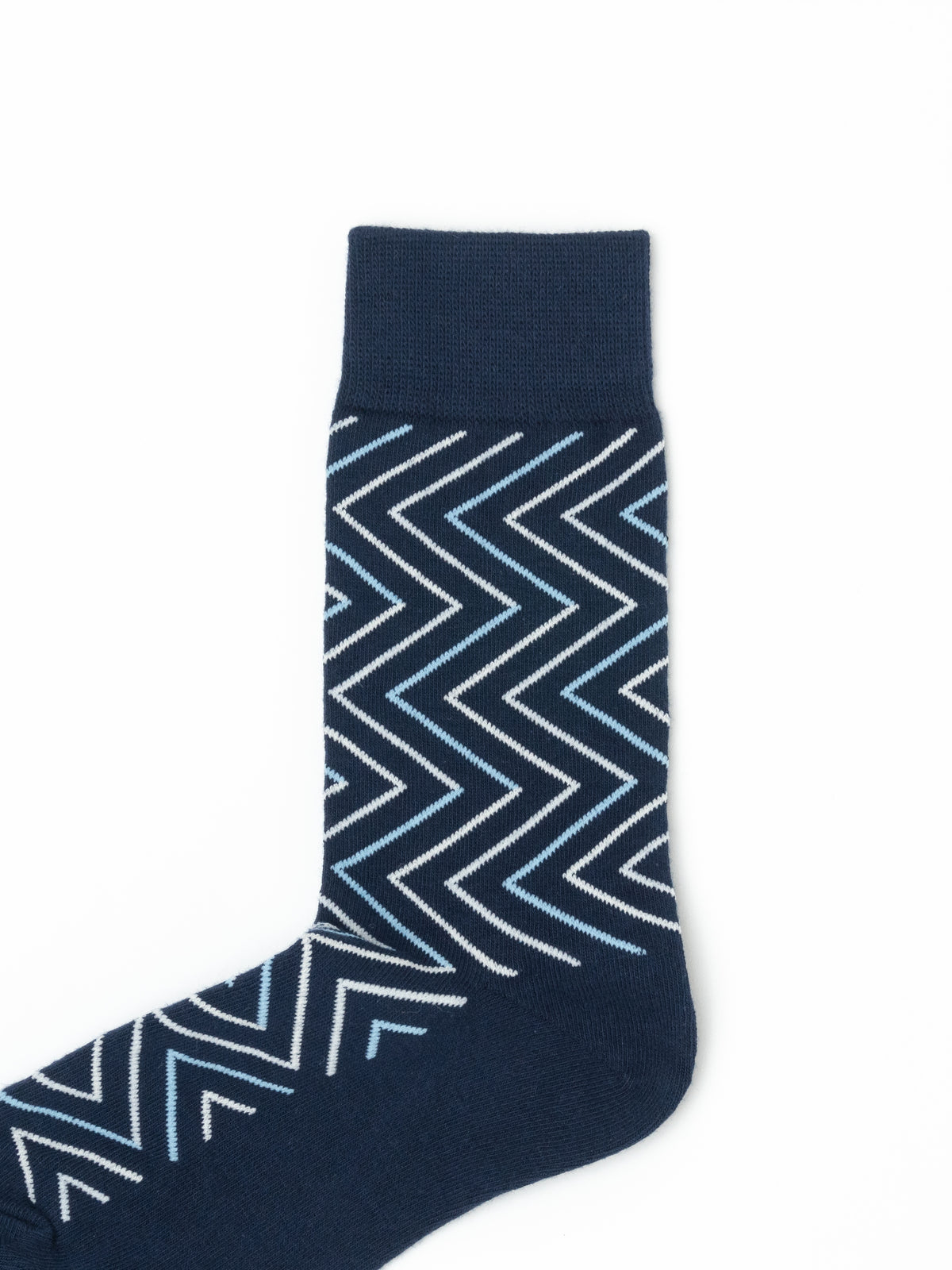 Close-up of a navy crew sock with a white and light blue chevron pattern and ribbed cuff.