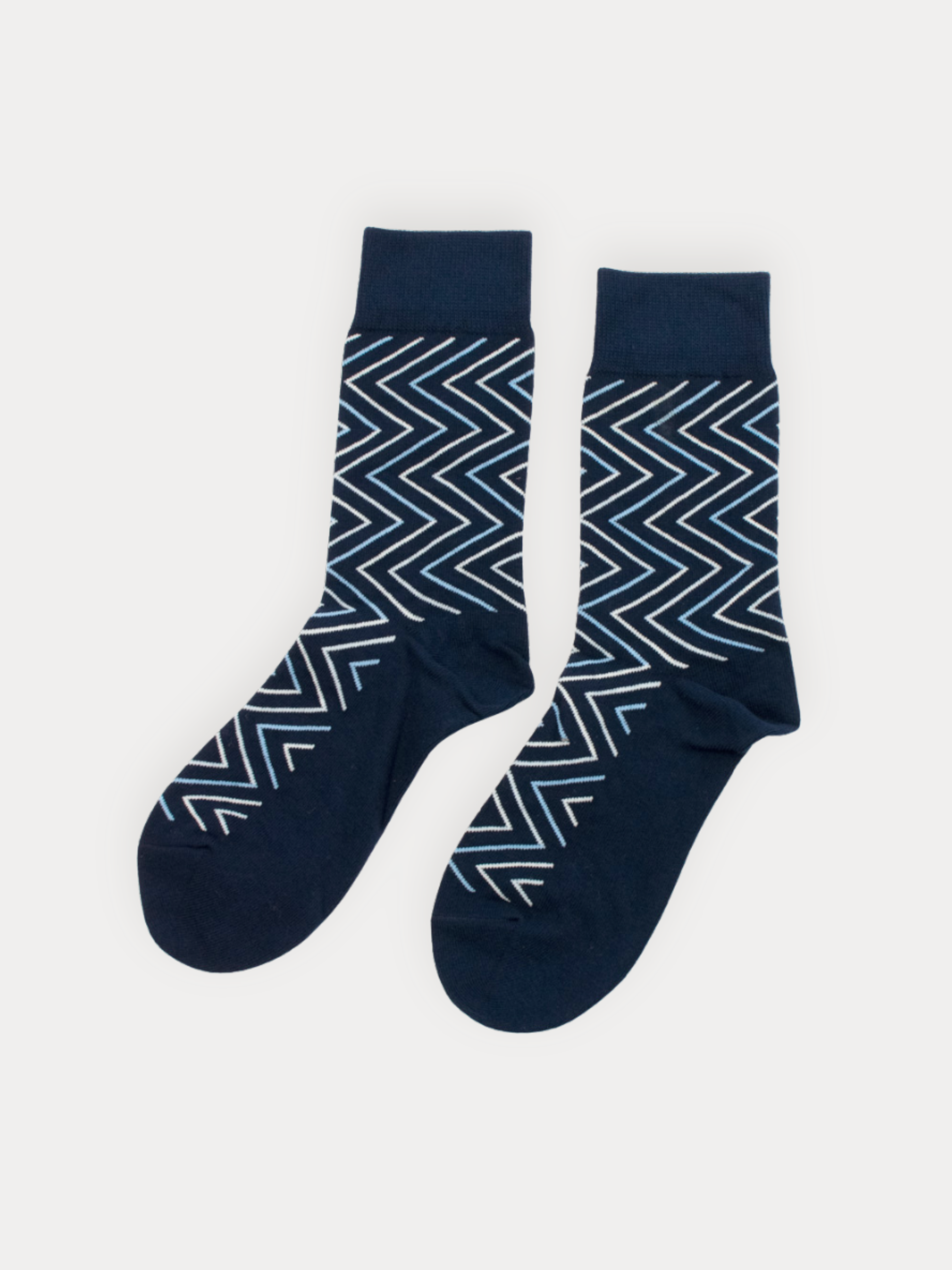 Soft navy crew socks with a layered chevron pattern in white and sky blue. 