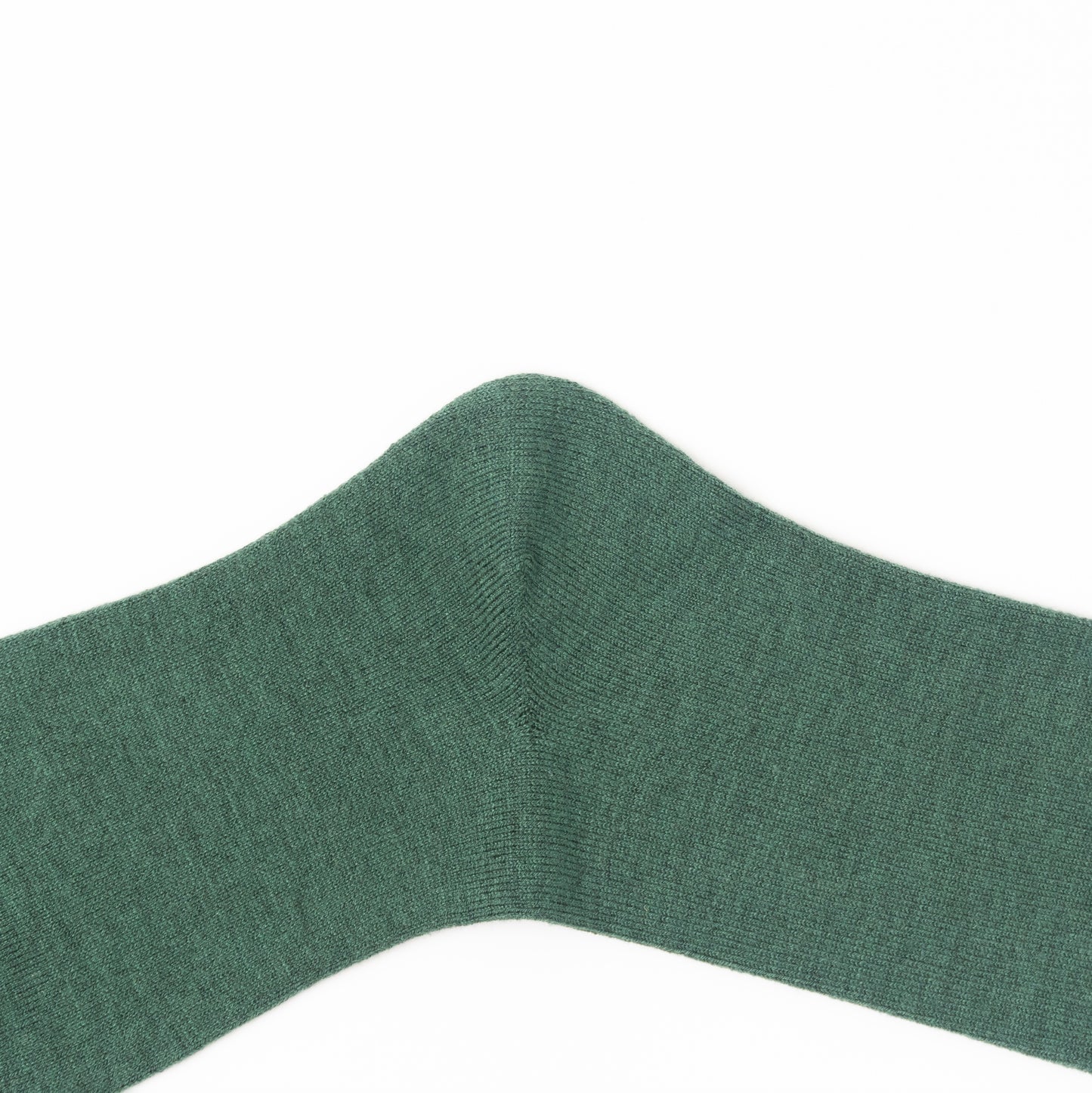 A close-up of a dark green ribbed knit fabric, likely a sock cuff, shown against a plain white background.