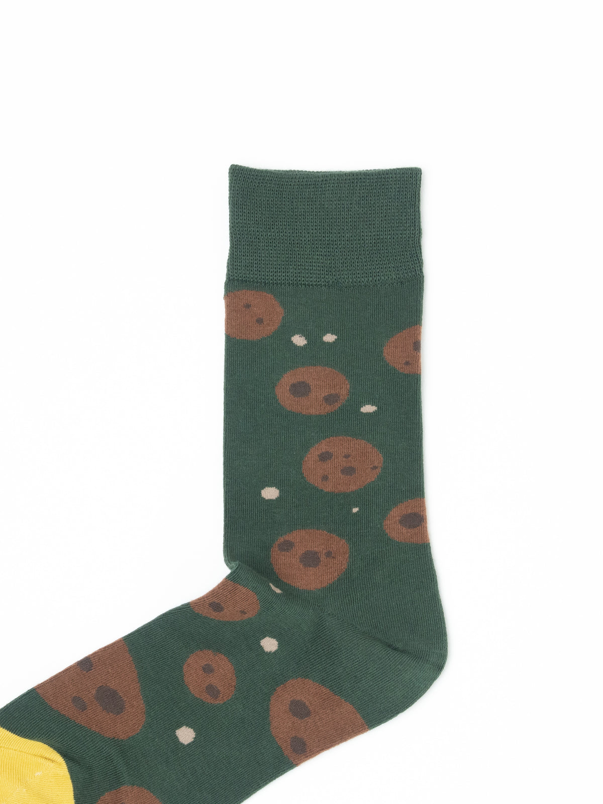 Close-up of a green crew sock with a chocolate chip cookie print and ribbed cuff.