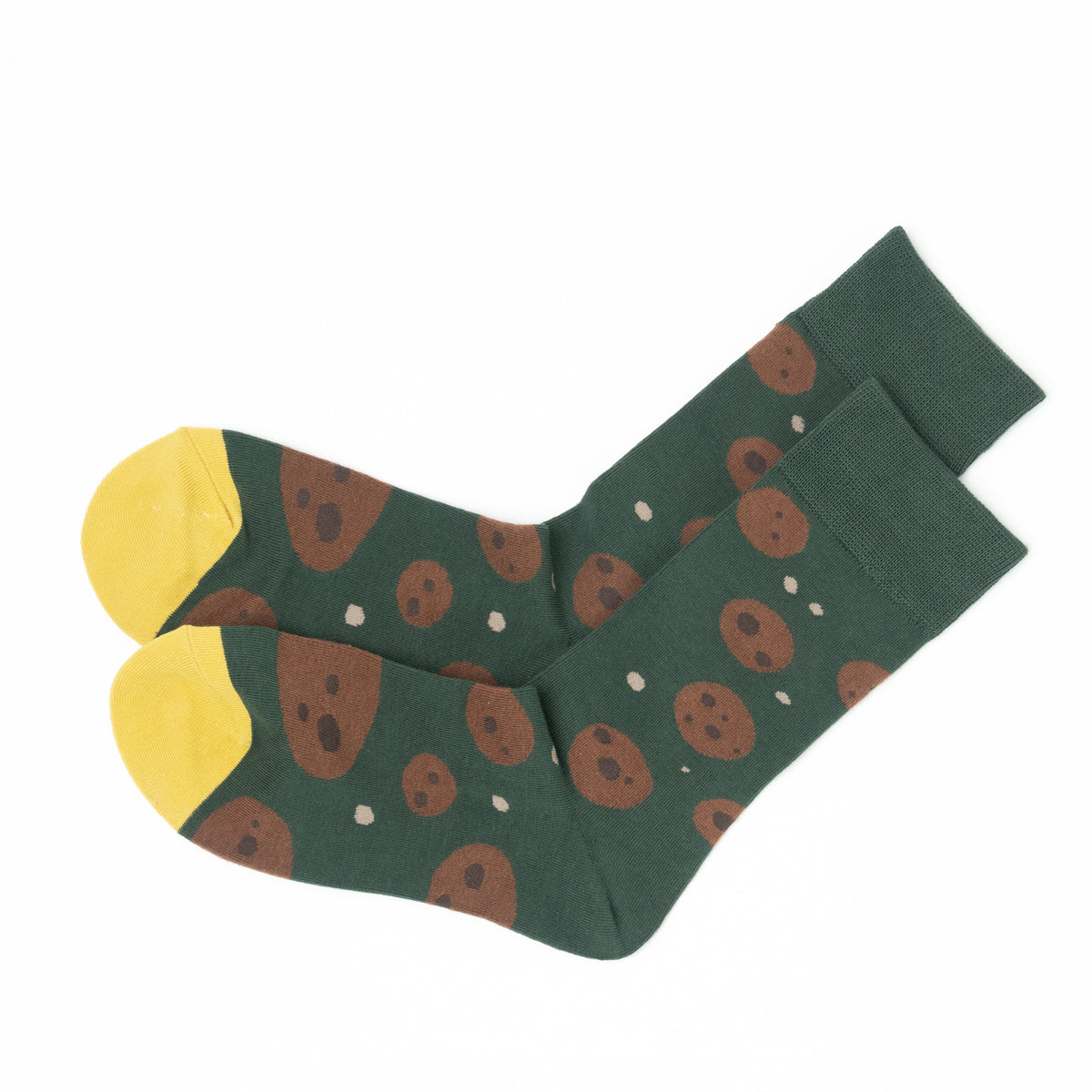 Pair of green crew socks folded together, showing the cookie print and yellow toes from heel to toe.