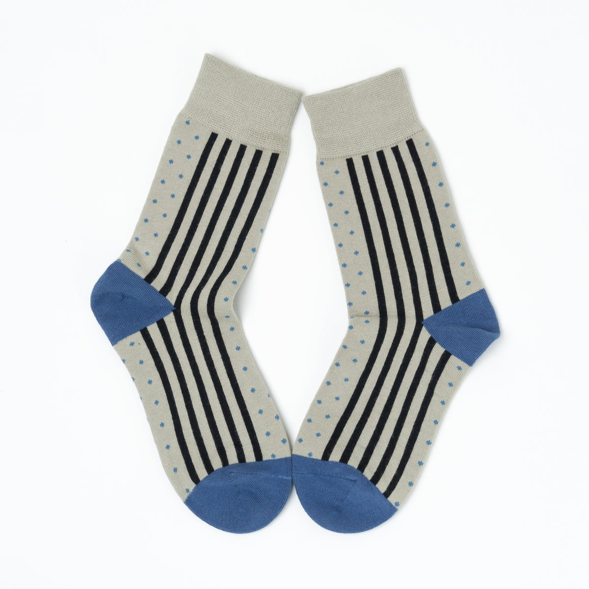 Close-up of two grey crew socks with blue heels and toes, showing dot and vertical stripe patterns side by side.