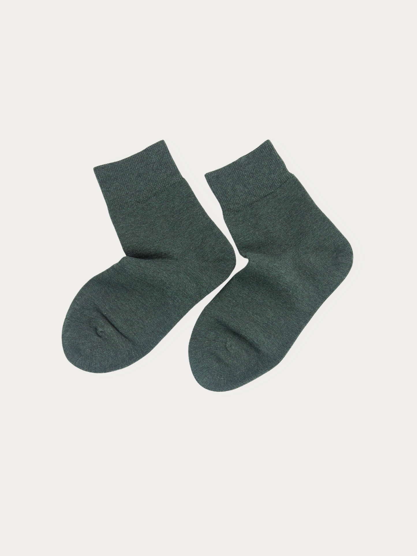 A pair of dark forest green crew socks displayed flat against a light gray background.