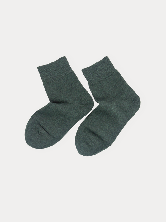A pair of dark forest green crew socks displayed flat against a light gray background.