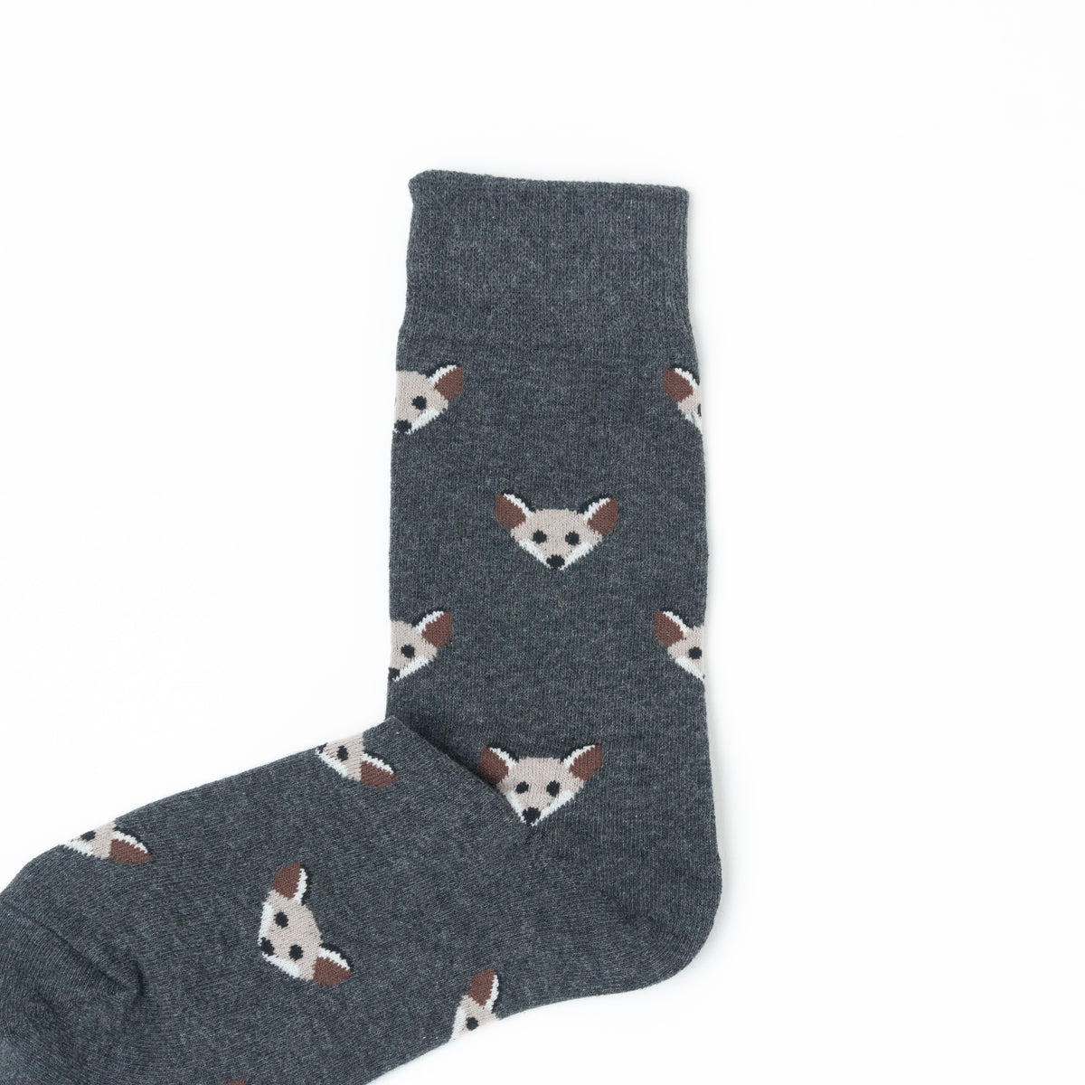A single dark gray sock with a repeating pattern of small white and brown fox faces, shown on a plain white background.