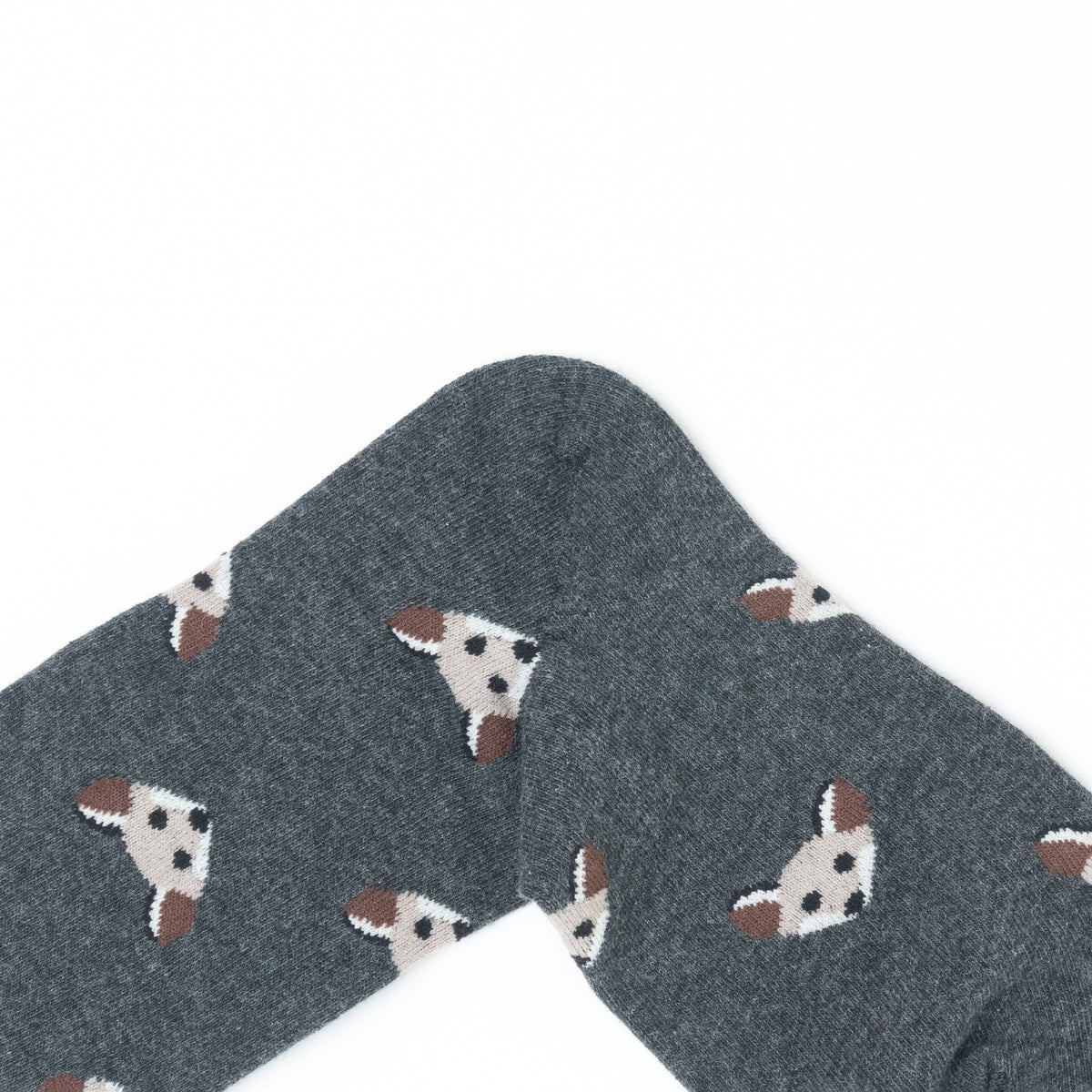 A close-up of a dark gray sock with a repeating pattern of small white and brown fox faces, shown against a plain white background.
