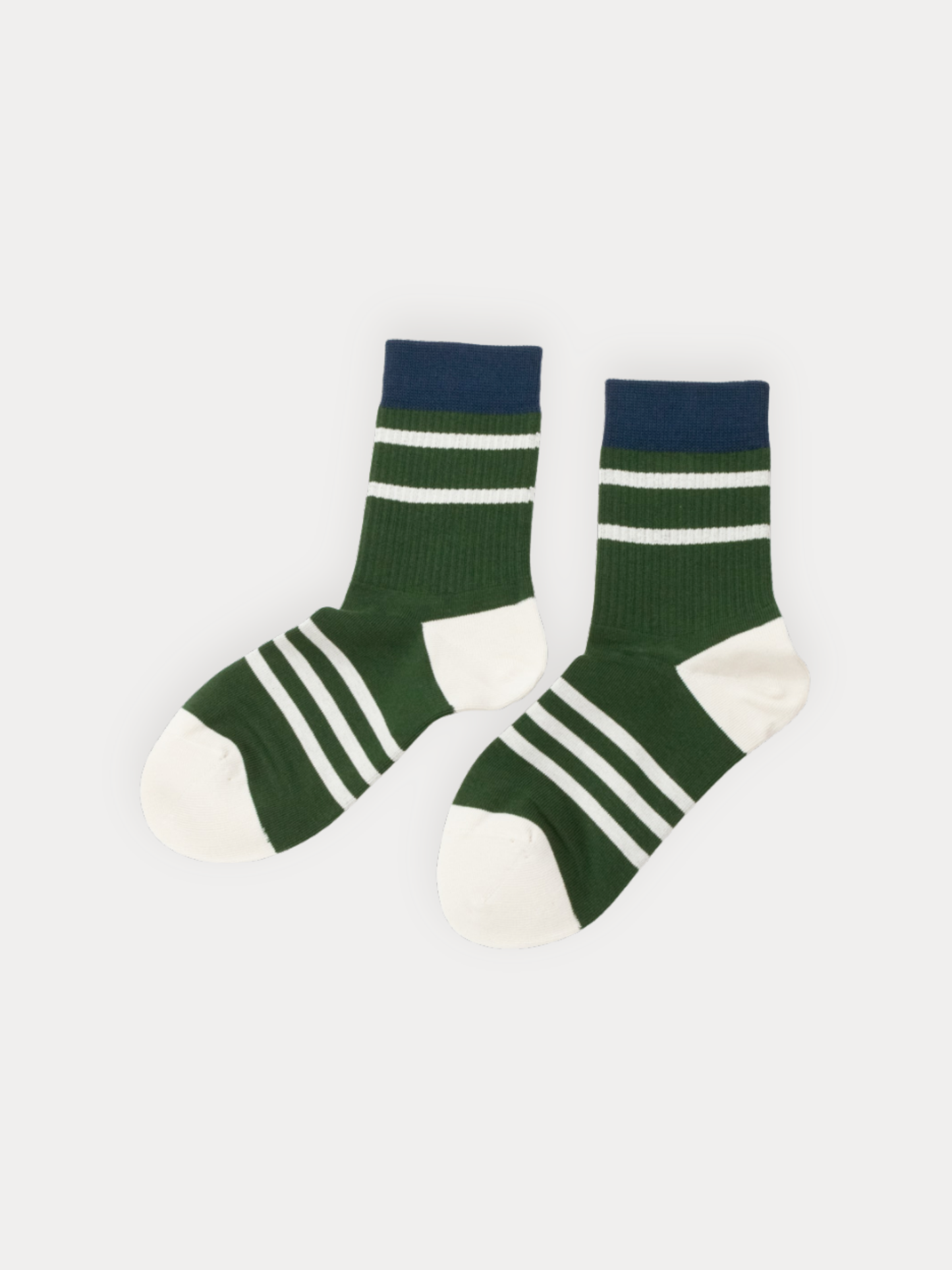 Pair of green and navy striped socks on a white background