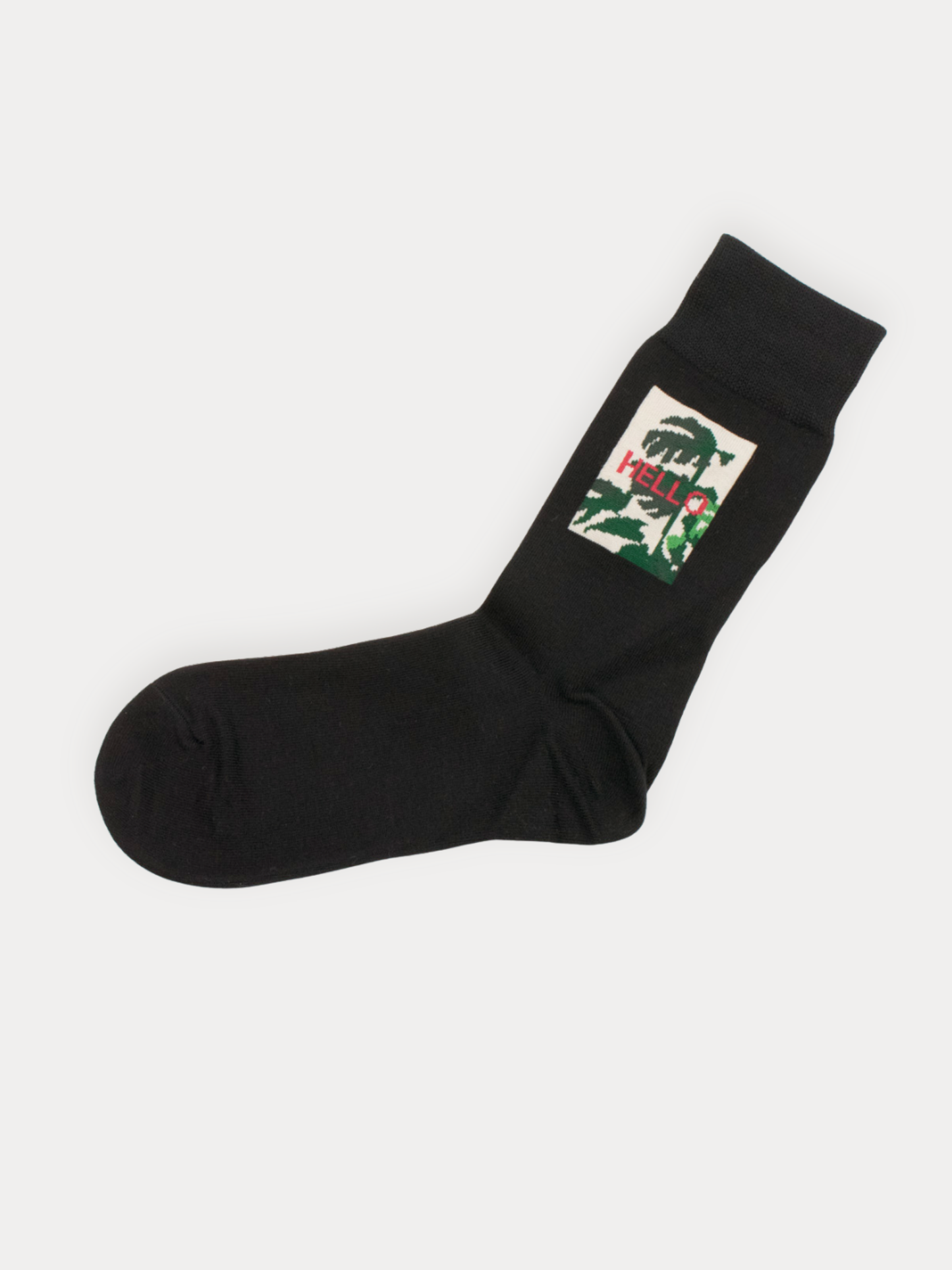 Soft black crew socks with a framed botanical "Hello" graphic. Cotton blend.