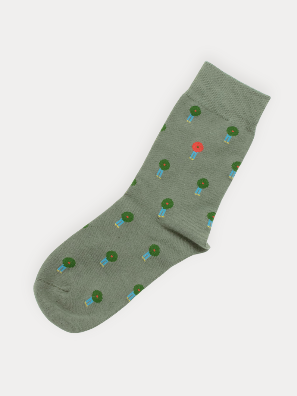 Green sock with tree pattern on a white background