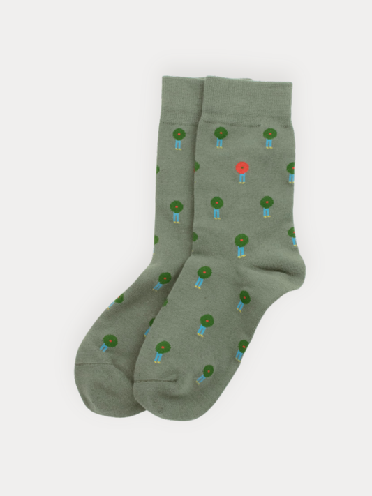 Green socks with small colorful patterns on a white background