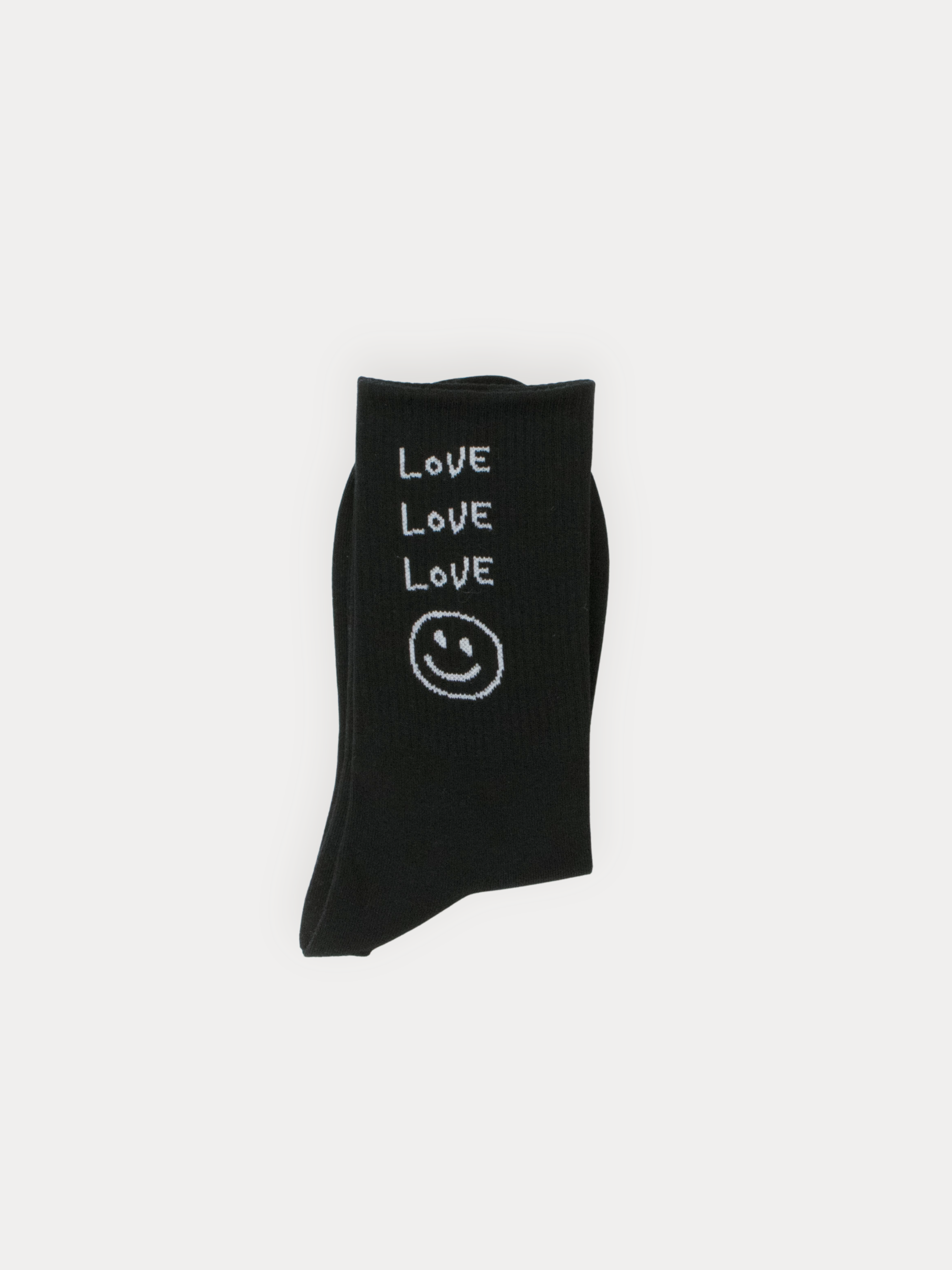 Black sock with 'LOVE' and smiley face design on a light gray background