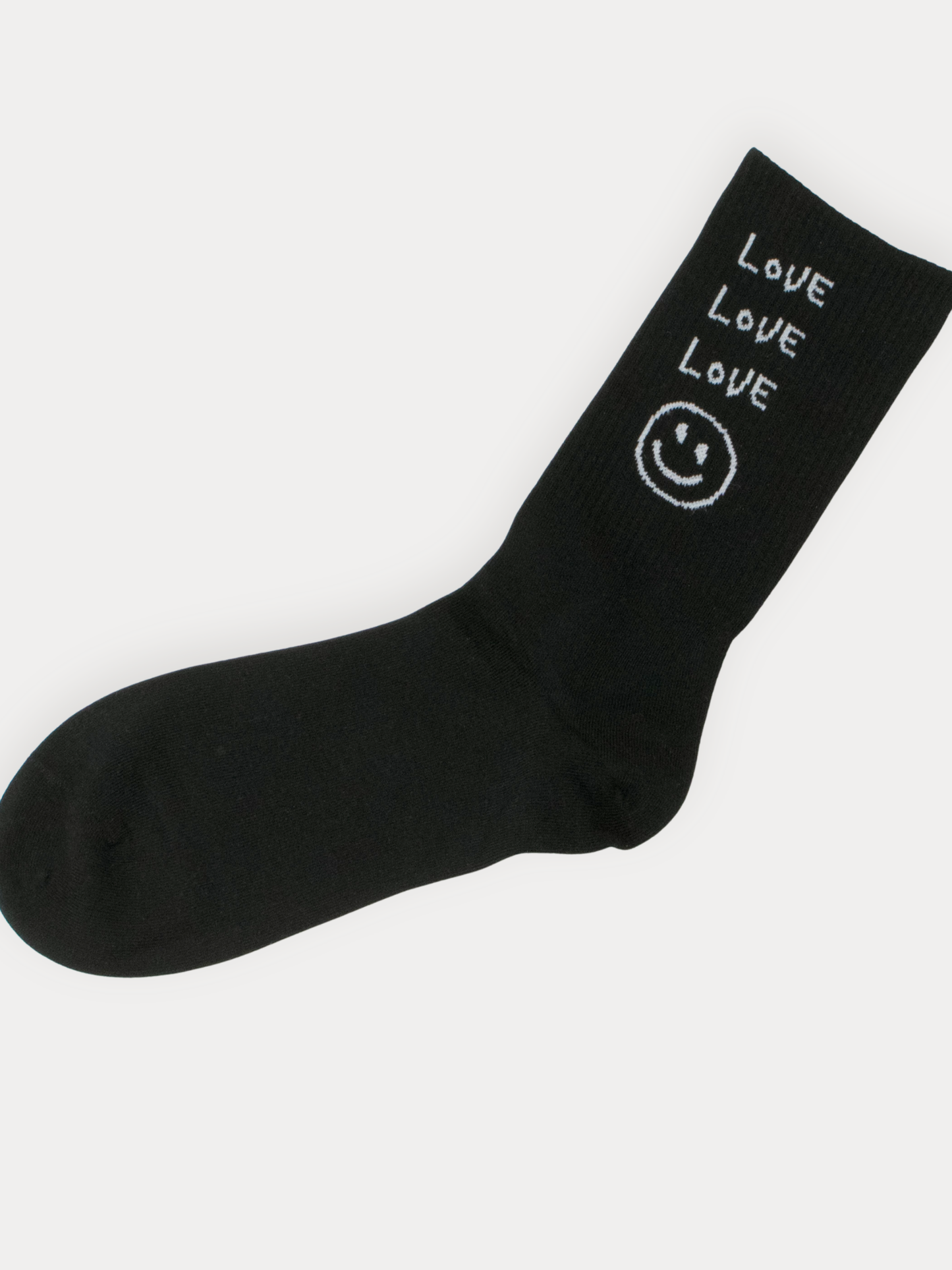 Black sock with 'LOVE' and smiley face design on a white background
