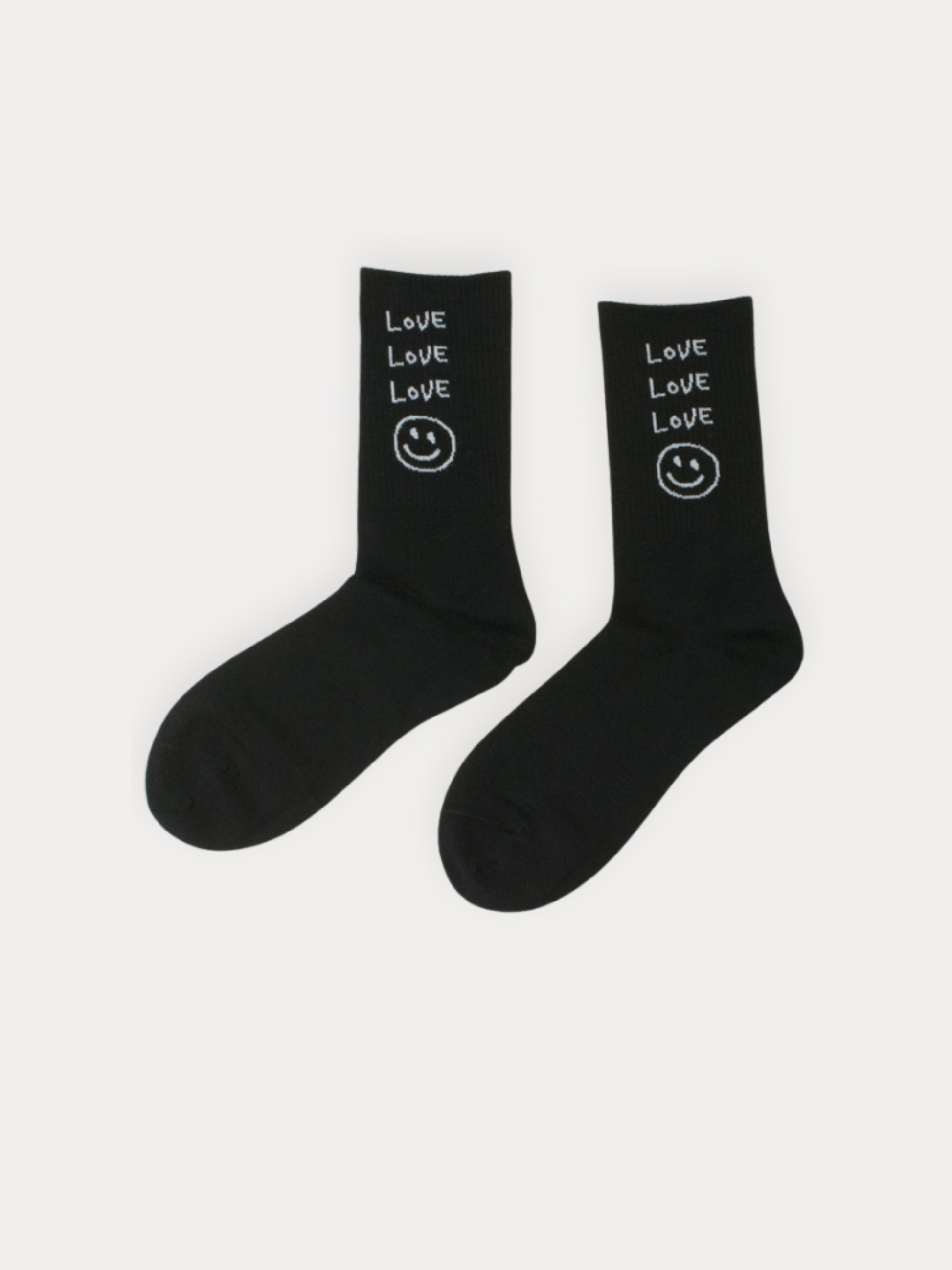 Black socks with 'Love' and smiley face design on a white background