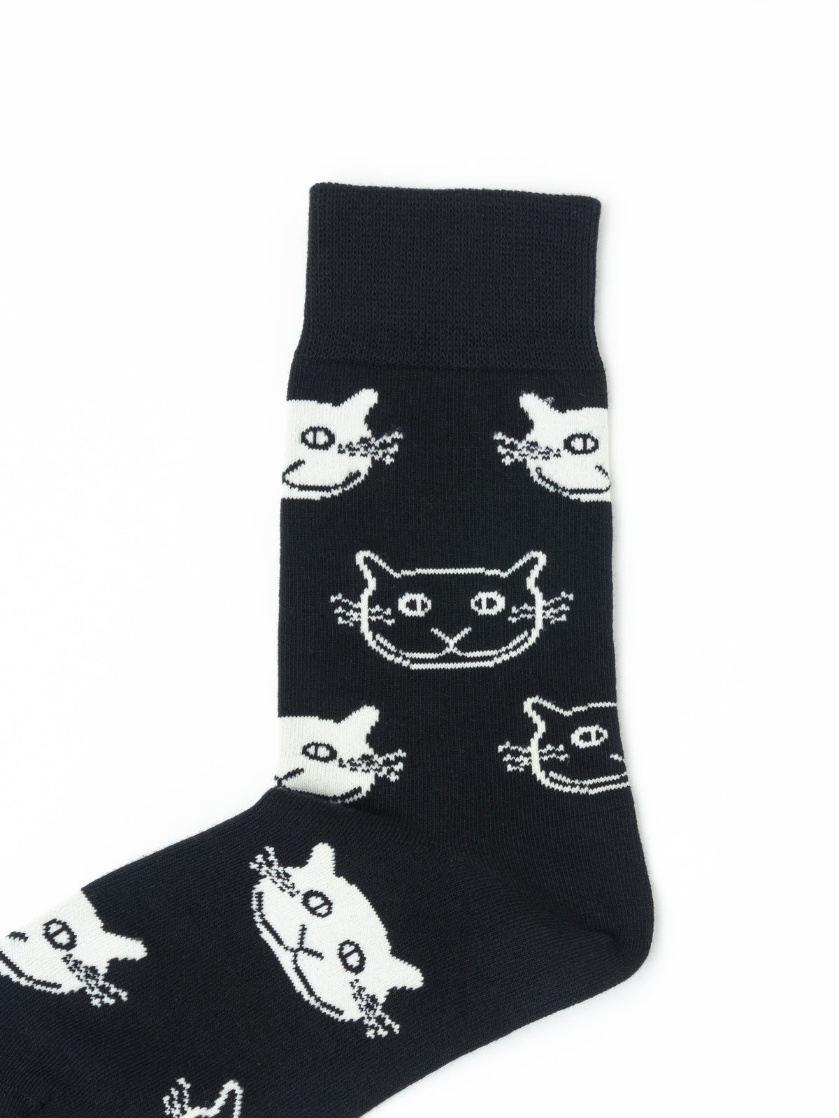 A single black crew sock with a repeating white cat face pattern, shown against a plain white background.