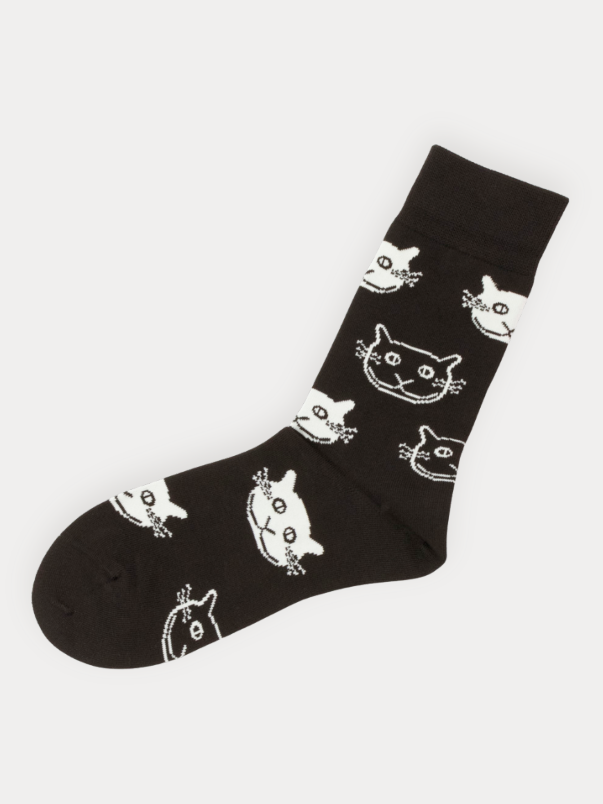 Black sock with white cat prints on a white background