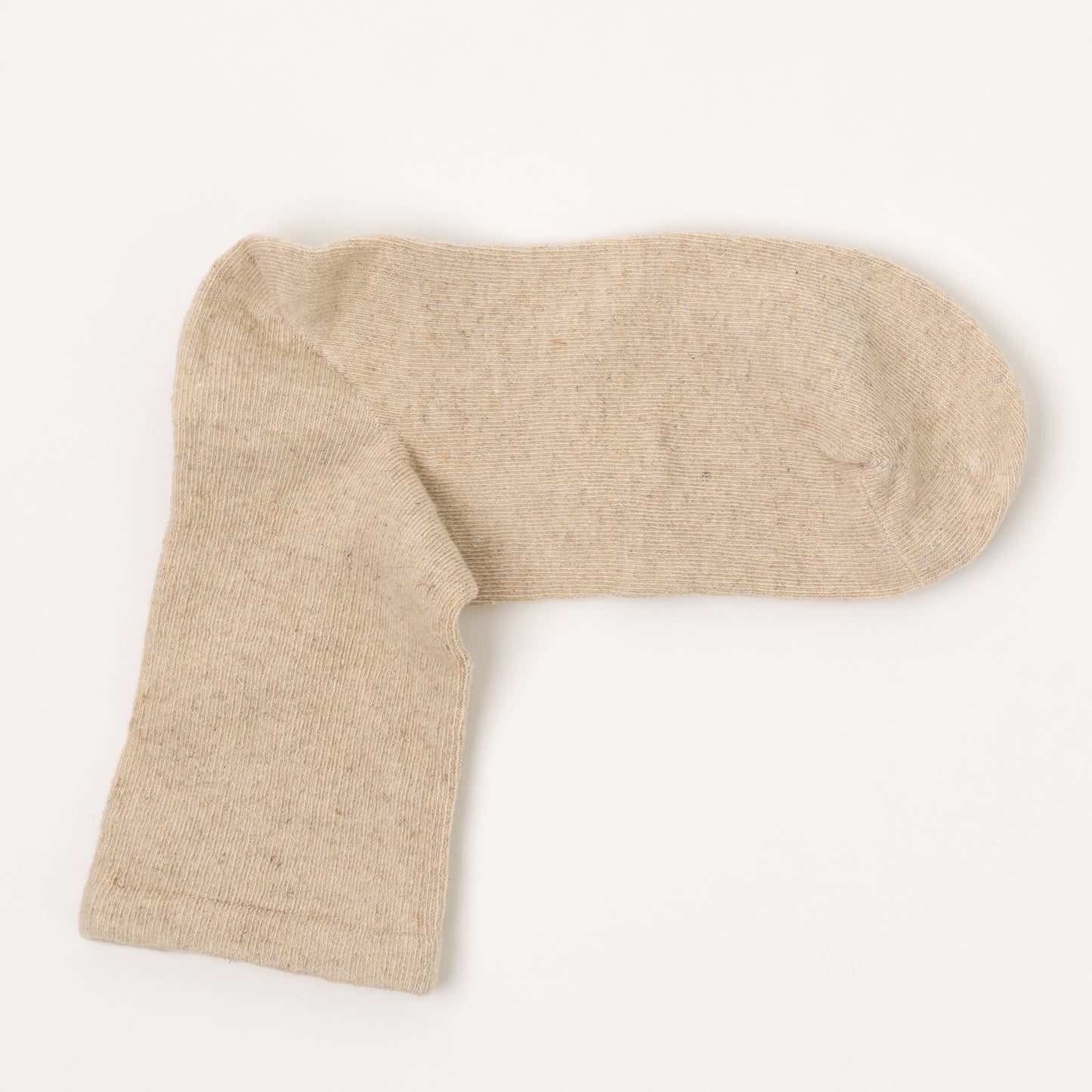 A single sock in a light beige heathered knit fabric, laid flat on a clean white background.