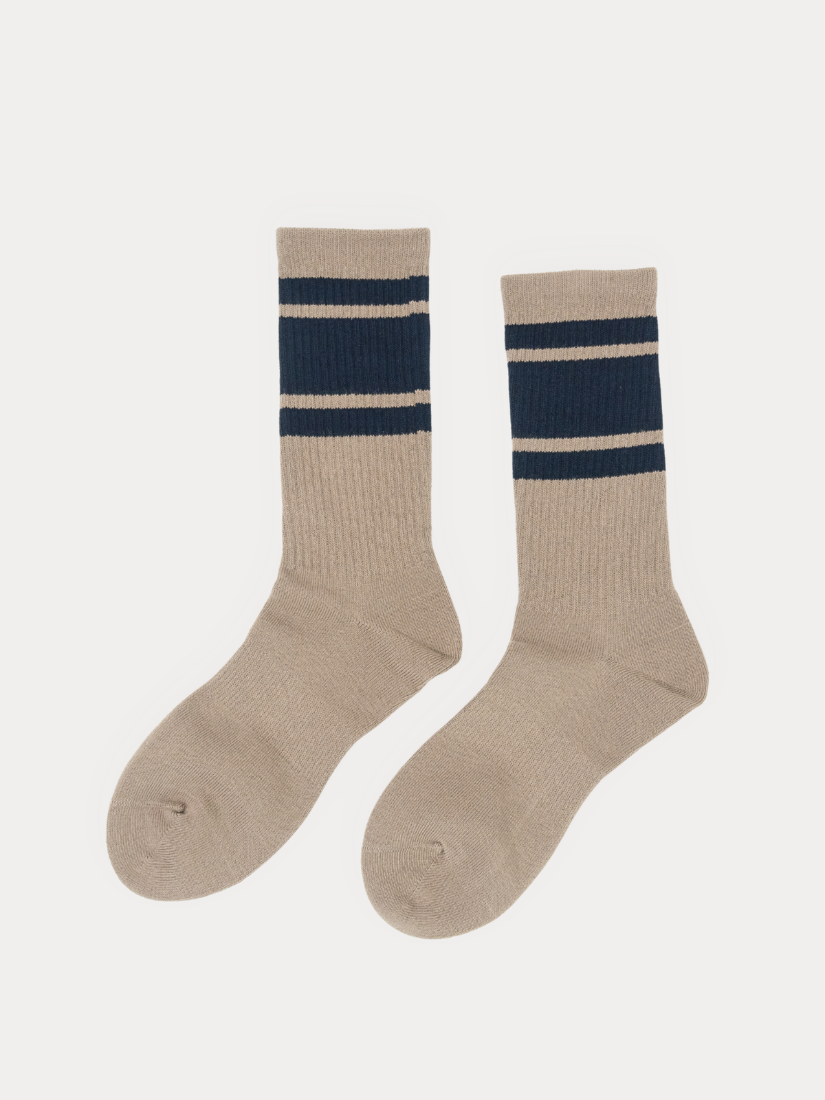 A pair of brown crew socks with two navy blue stripes near the cuff, displayed against a light gray background.