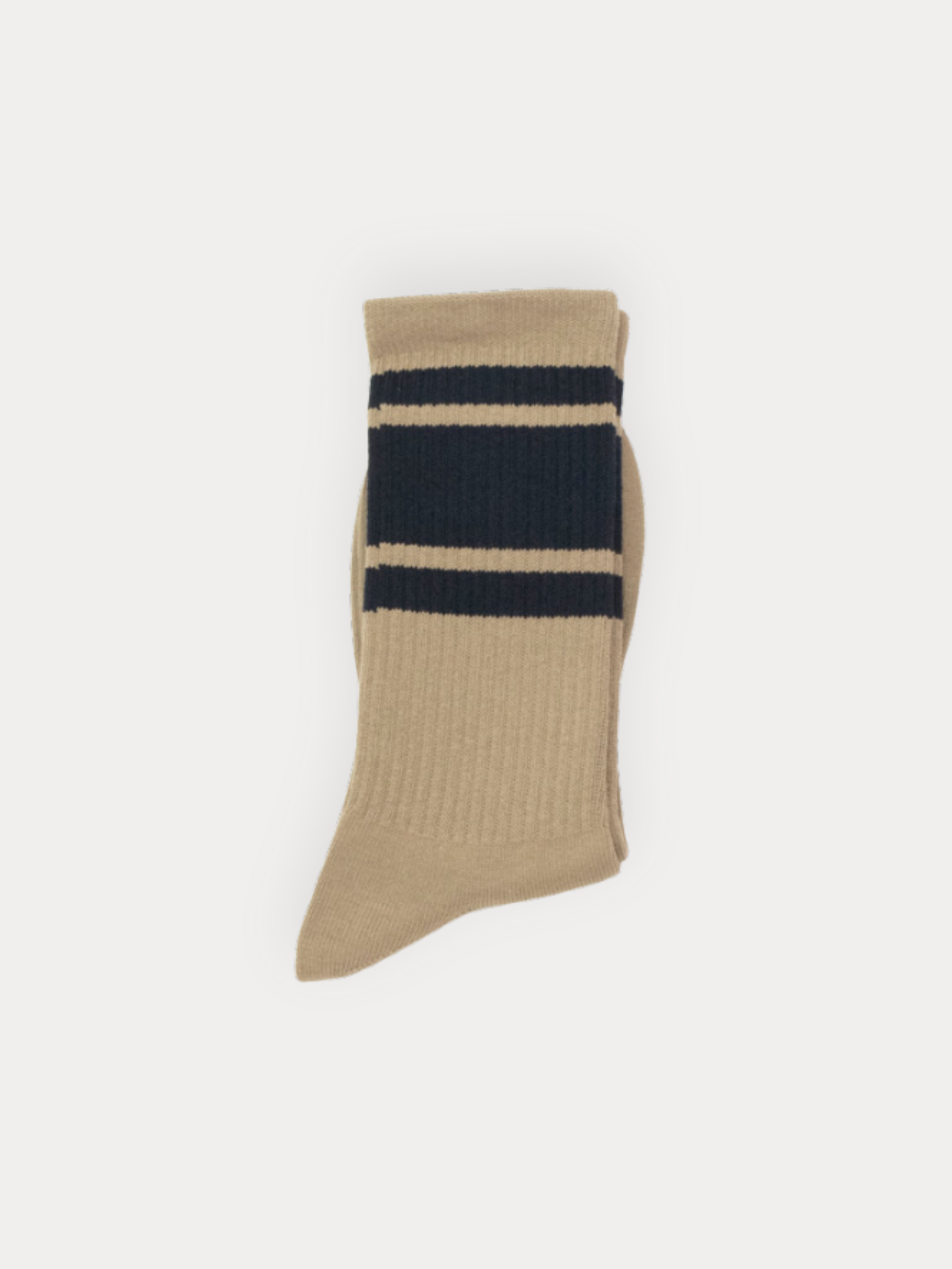 A pair of ribbed crew socks in tan with two bold navy stripes at the cuff.