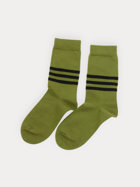 Pair of green socks with black stripes on a white background