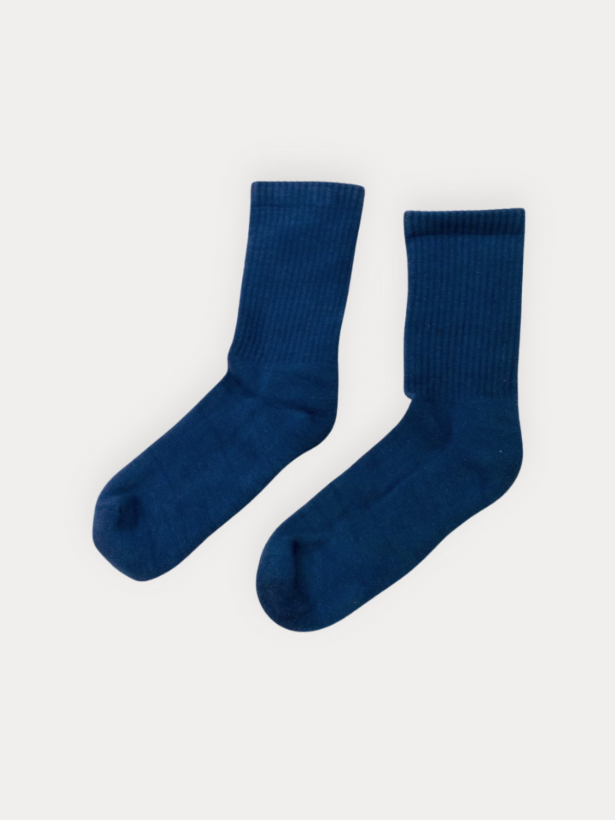 A pair of dark blue ribbed crew socks displayed flat against a light gray background.