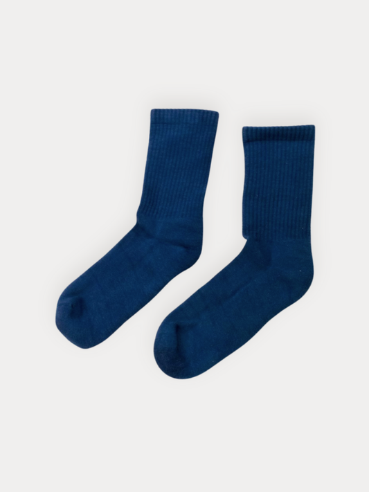 A pair of dark blue ribbed crew socks displayed flat against a light gray background.