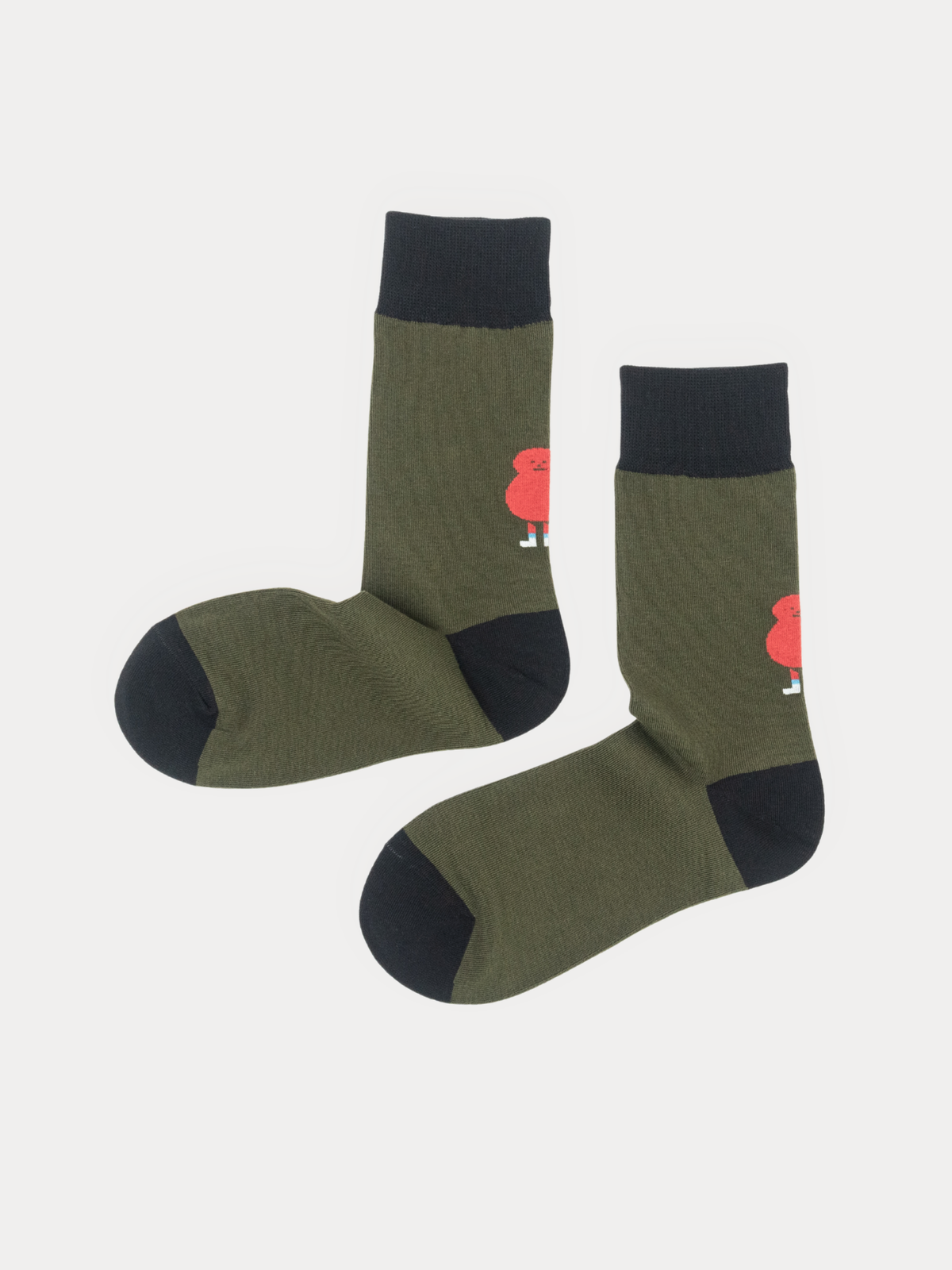 A pair of olive green crew socks with black cuffs, heels, and toes, featuring a small red cartoon character printed on the side, displayed against a light gray background.