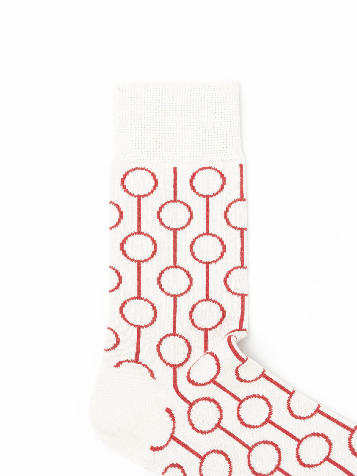 A single white knit sock with a repeating red circular chain pattern, shown against a plain white background.