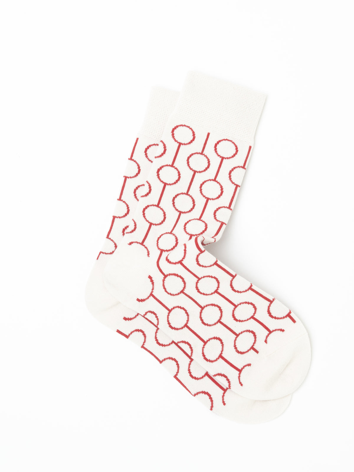 Pair of Red Circle Socks laid one over the other, folded at the ankle, with cream toes and heels left plain.