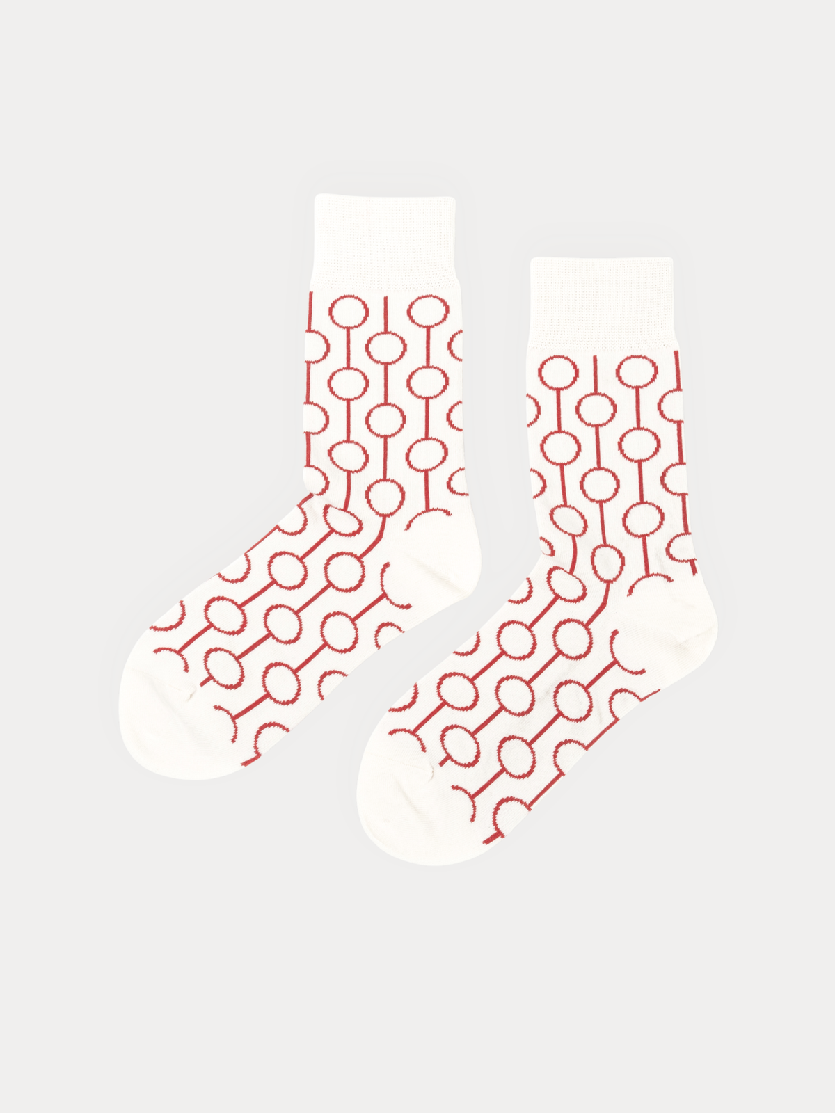 Pair of Red Circle Socks in cream, with red outlined circles linked by thin lines running down each sock.