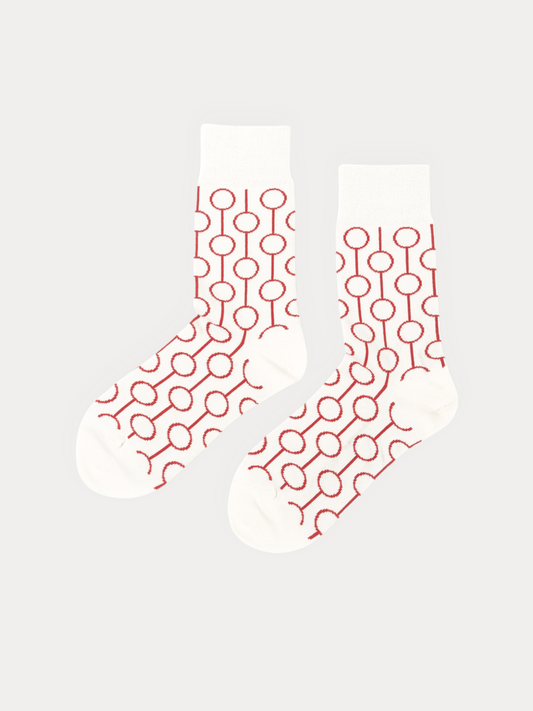 Pair of Red Circle Socks in cream, with red outlined circles linked by thin lines running down each sock.