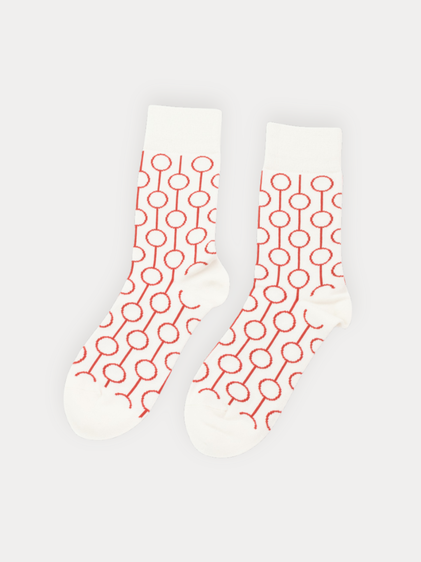 White socks with red geometric pattern on a white background