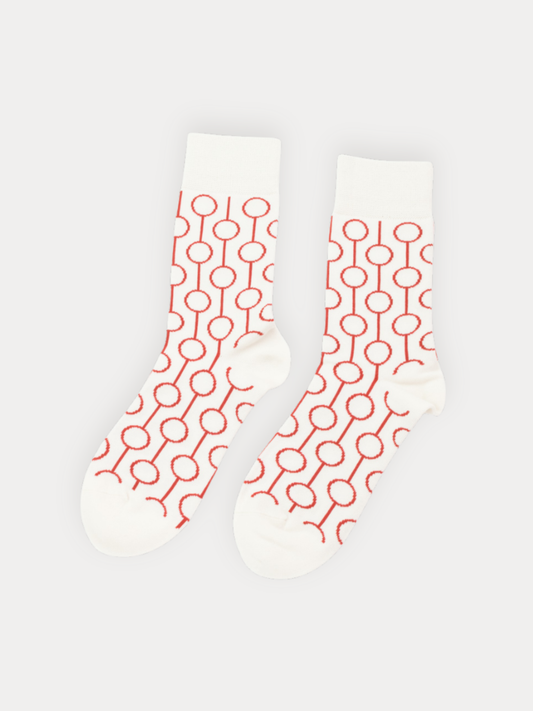 White socks with red geometric pattern on a white background