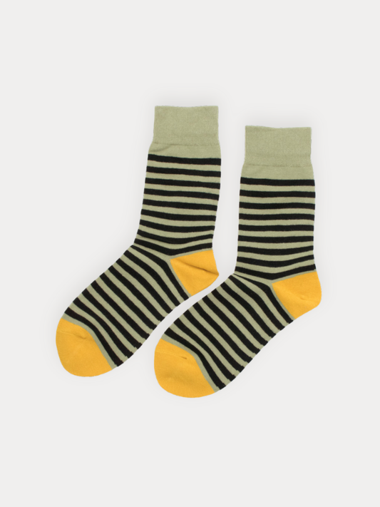 Pair of striped socks with green and yellow accents on a white background