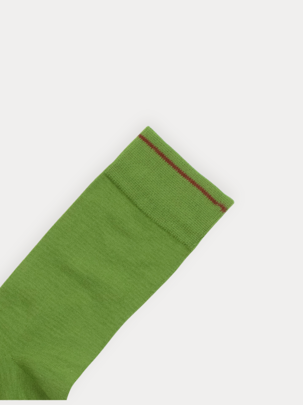 Green sock with a red trim on a white background