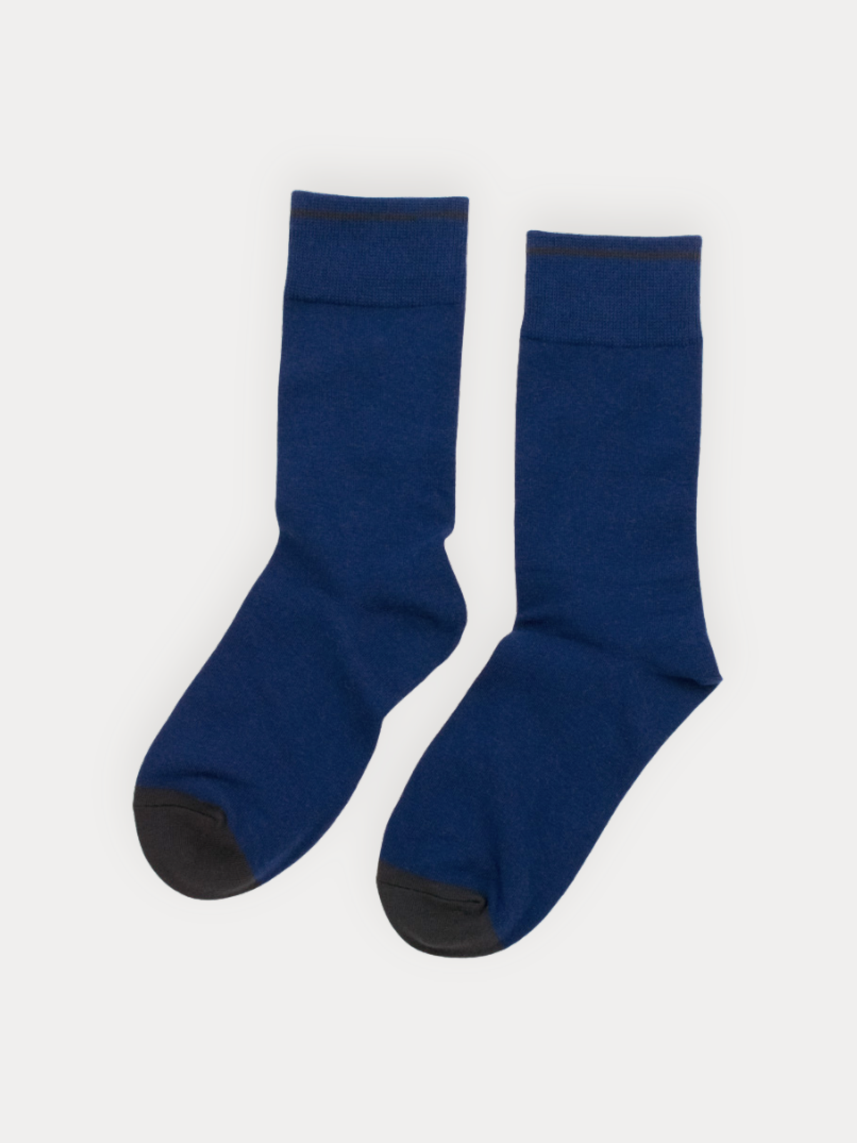 Pair of blue socks on a white background