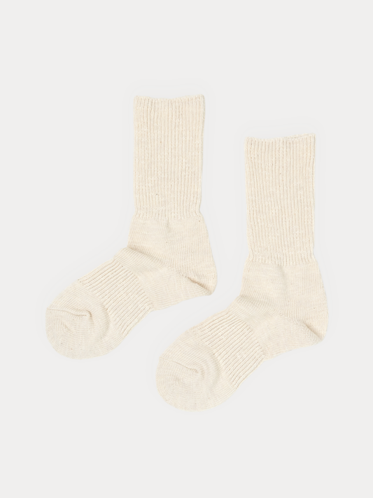 Thick Cotton socks in natural cream, standing upright with a chunky ribbed knit and no pattern.