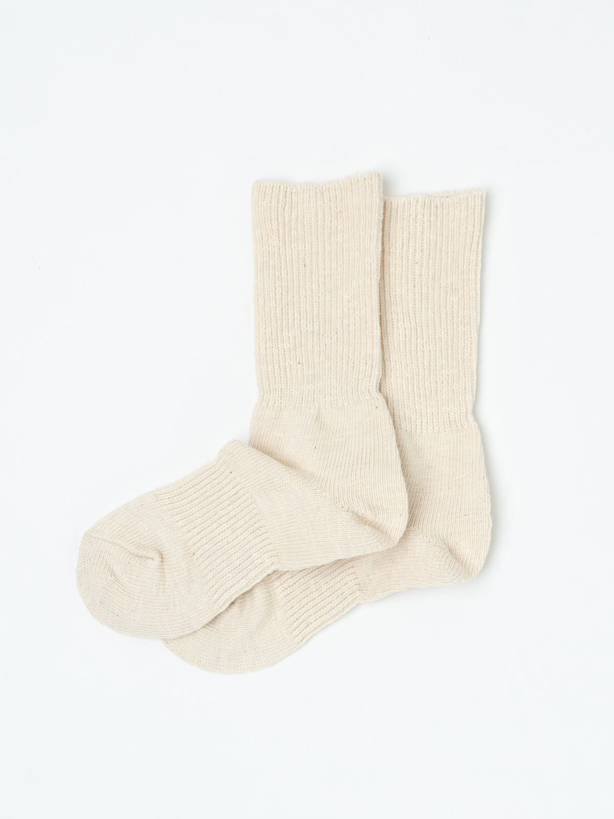 Pair of cream Thick Cotton socks laid side by side with one toe resting over the other.