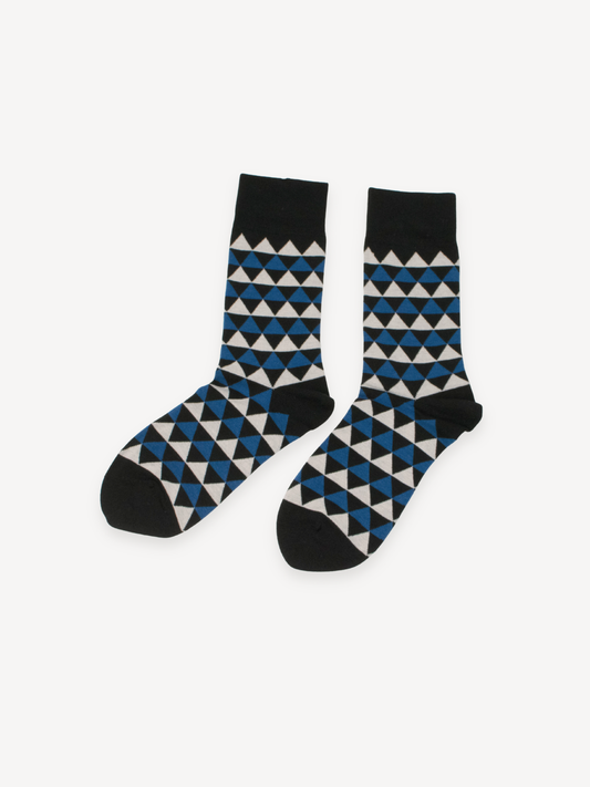 Pair of socks with black, blue, and white geometric pattern on a white background
