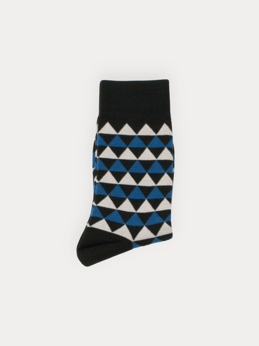 Black sock with blue and white geometric pattern on a light gray background
