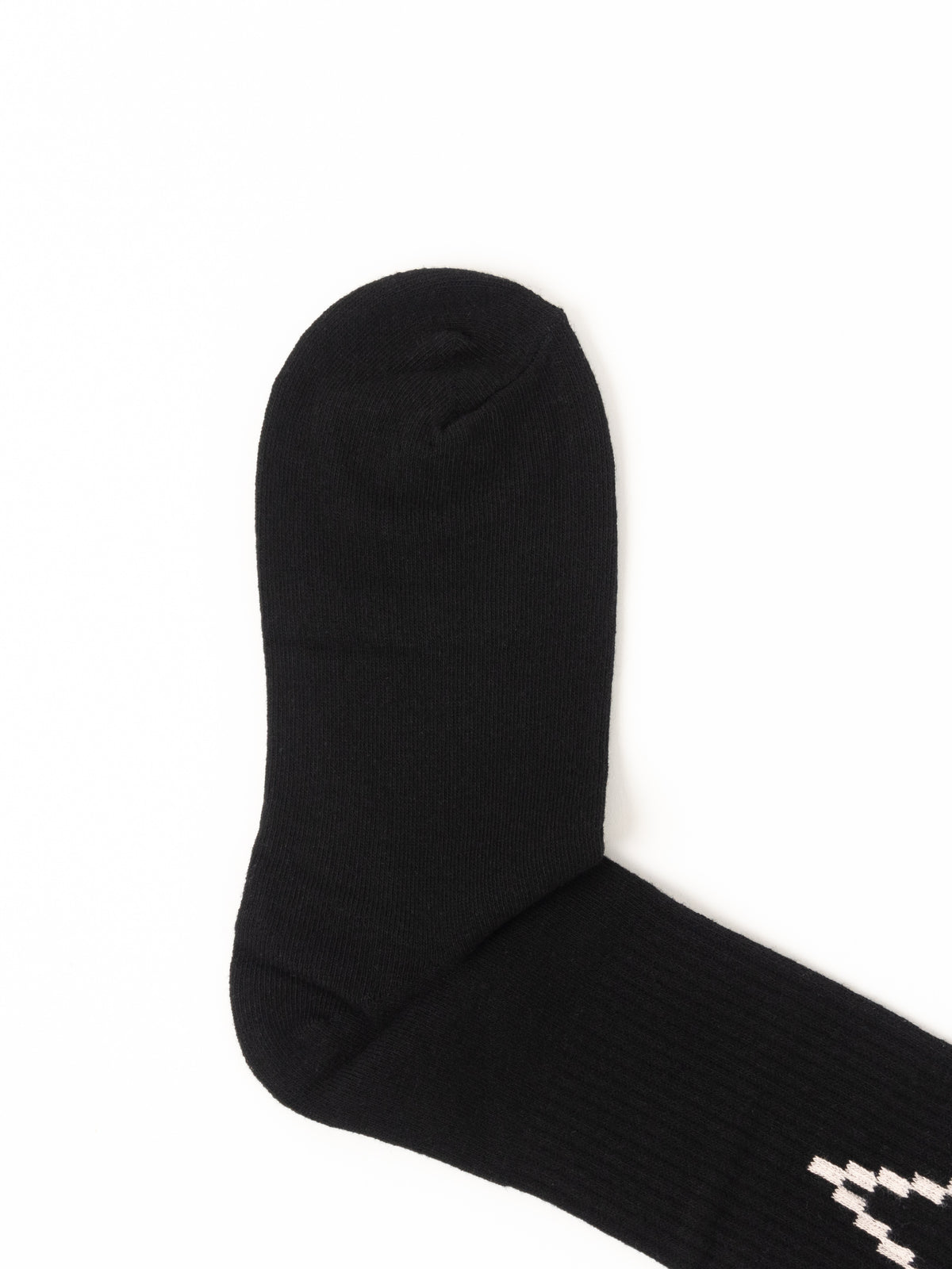 A single black crew sock with a small white geometric pattern near the cuff, shown on a plain white background.