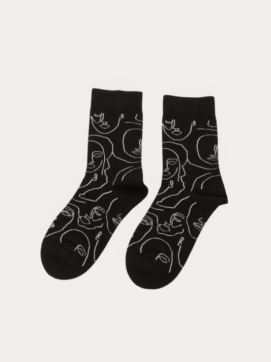 A pair of women's crew socks with Black and white line-art faces.
